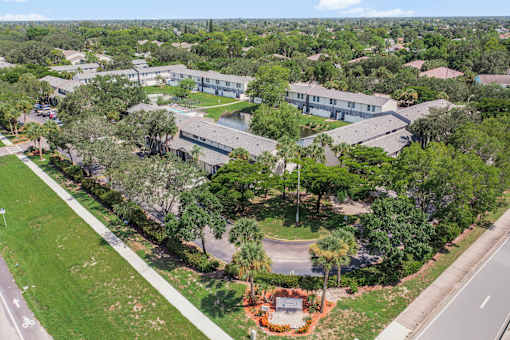 A bird's eye view of a residential area with houses and trees.