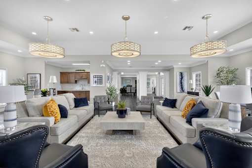 Modern clubhouse lounge with stylish furnishings at The Ivy at Gatehouse Apartments, Orlando