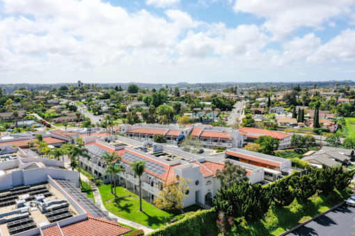 A view of a residential area with houses and buildings.
