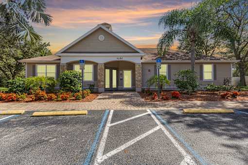 Building with parking lot in front at Mer Soleil Apartments, Naples, Florida