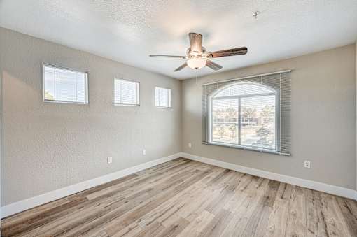 Empty bedroom with wood style flooring at Borgata Condominiums Apartments, Las Vegas