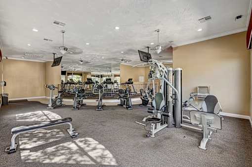 Fitness center with cardio machines and weight stations at Borgata Condominiums Apartments, Las Vegas, NV 89103