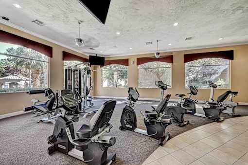 Fitness center with recumbent bikes and equipment at Borgata Condominiums Apartments, Las Vegas, NV