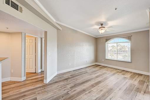 Spacious empty living area with wood style flooring at Borgata Condominiums Apartments, Las Vegas