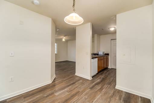 A kitchen area with a dishwasher and a refrigerator.
