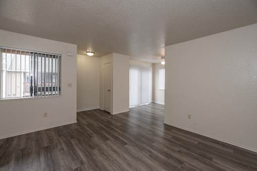 A room with a window and a door.