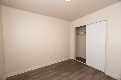 A room with a white wall and a white door.