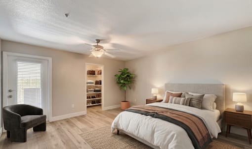 Bedroom with builtin storage and ceiling fan at Borgata Condominiums Apartments, Las Vegas, NV 89103