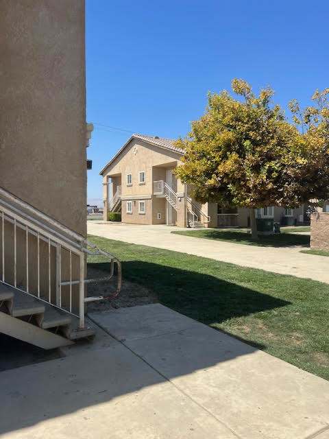 A house with a tree in front of it.