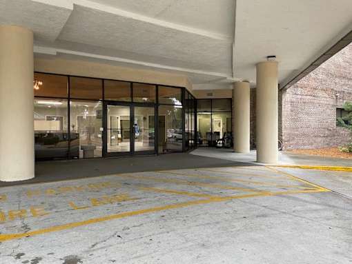 A parking garage with the words "Parking Garage" painted on the ground.