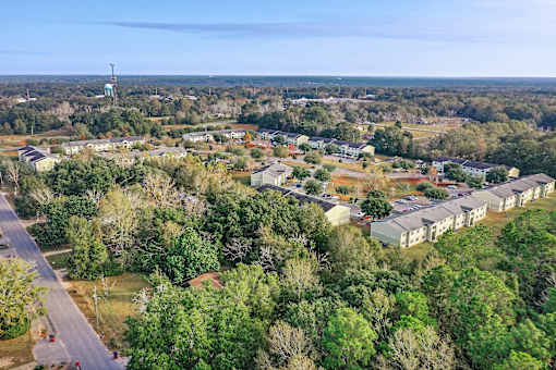 A bird's eye view of a residential area with houses and trees.