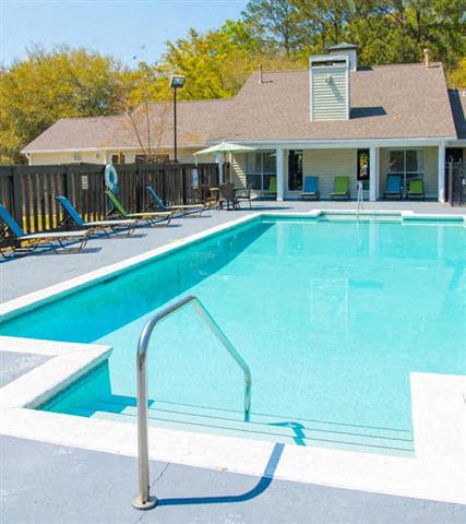 Pool Side Relaxing Area With Sundeck at Springwood Townhomes Apartments, Tallahassee, Florida