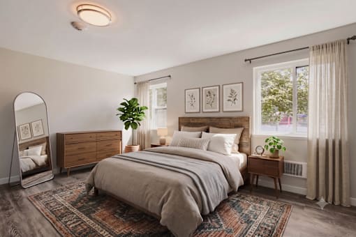 A bedroom with a large bed, a dresser, and a mirror.