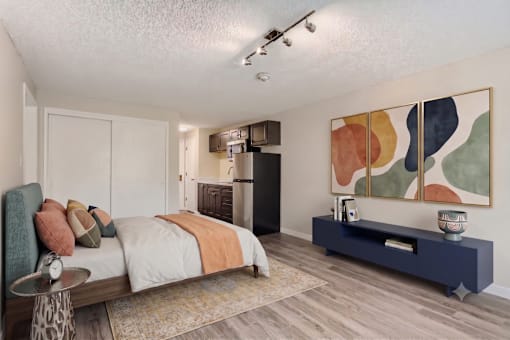 A bedroom with a bed, a nightstand, and a painting on the wall.