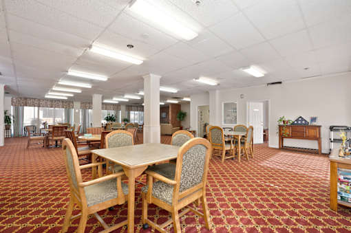 A room with a table and chairs in it.