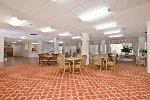 A large room with tables and chairs.