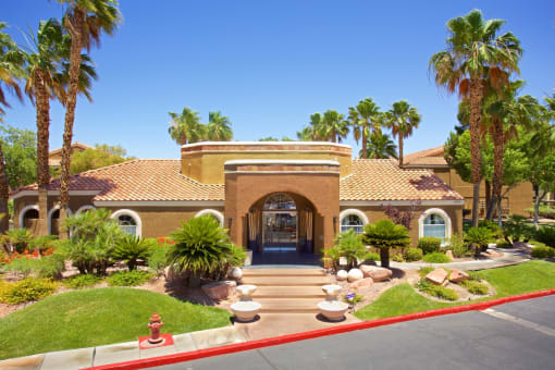 a house with palm trees in front of it