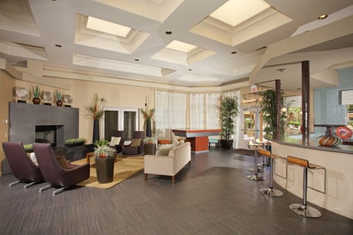 a lobby of a hotel with couches and chairs