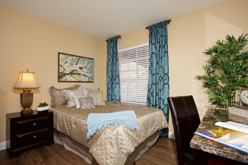 a bedroom with a bed and a christmas tree