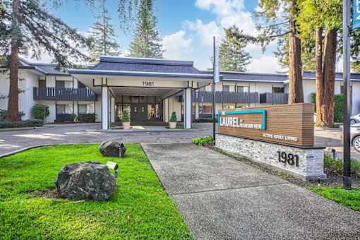 The image shows a building with the number 1981 on it and a sign that reads "Laurelwood Inn".