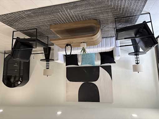 A modern interior with a black and white abstract wall design.