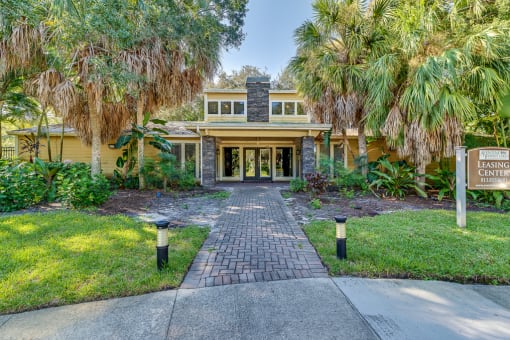 a house with palm trees in front of it