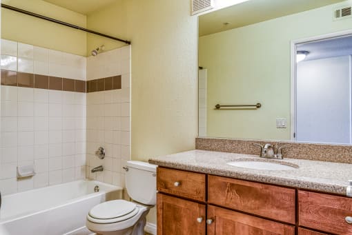 a bathroom with a sink toilet and a tub