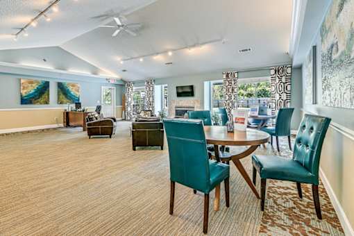 A room with a table and chairs in it.