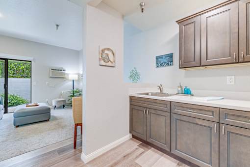 A kitchen with a sink and cabinets.