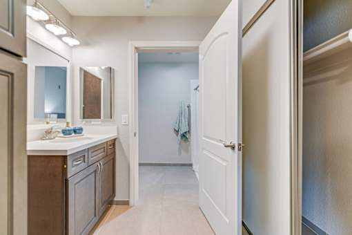 A kitchen with a white door leading to a hallway.