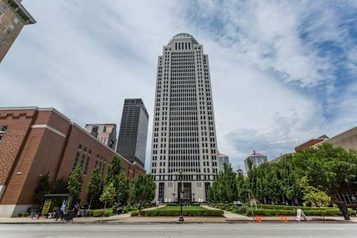 a tall building in the middle of a city street