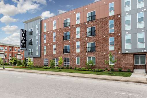 an apartment building on the side of a street