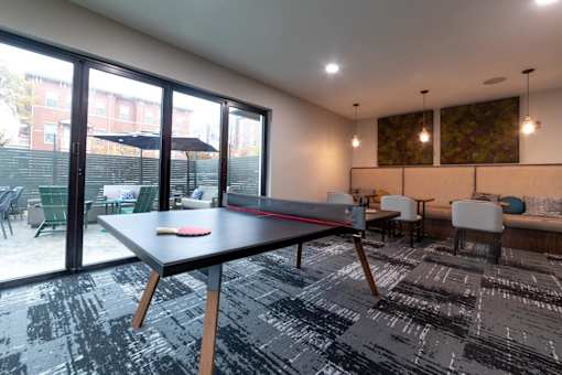 a games room with a ping pong table