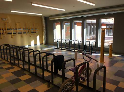 A bicycle is parked in a bike rack.