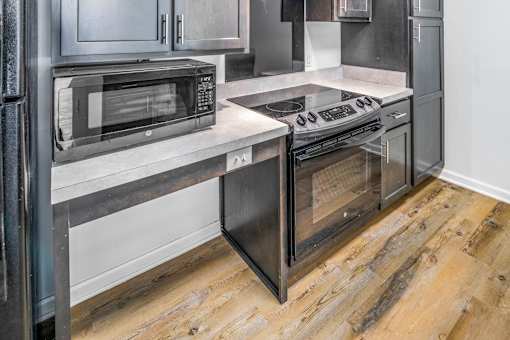 a kitchen with stainless steel appliances and a counter top