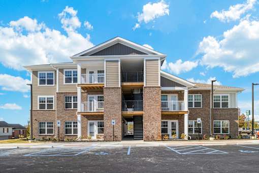 the exterior of a building with a parking lot