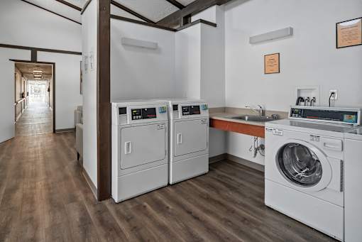 A laundry room with a washer and dryer in it.