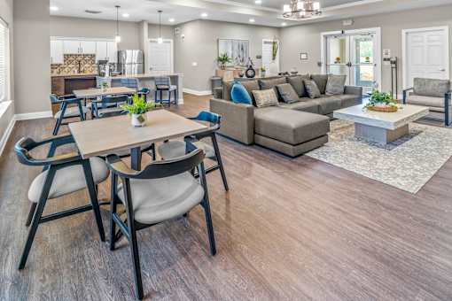 A living room with a dining table and chairs.