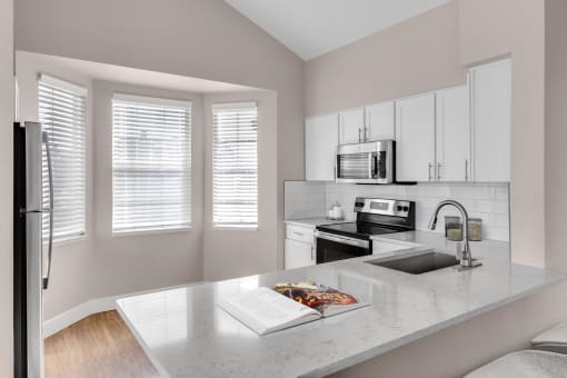 Kitchen with breakfast bar at The Links at Plum Creek in Castle Rock, CO