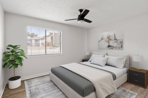 an image of a bedroom with a bed and a ceiling fan