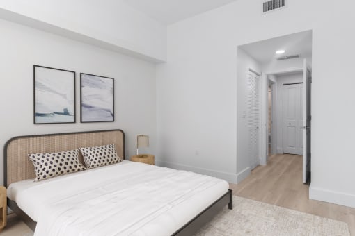 a bedroom with a large bed and a closet at One Plantation in Plantation, FL 33324