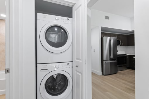 a front loading washer and dryer in a laundry room at One Plantation in FL 33324