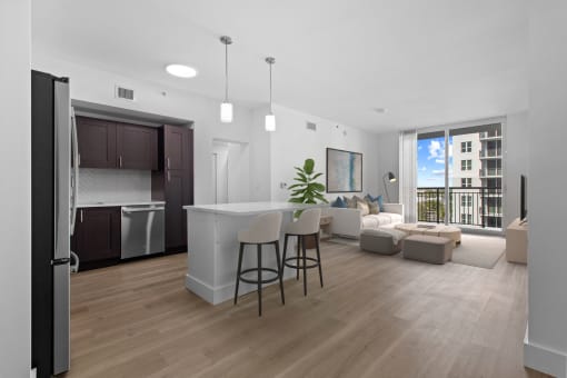 a living room with a kitchen and a dining room at One Plantation in Plantation, Florida