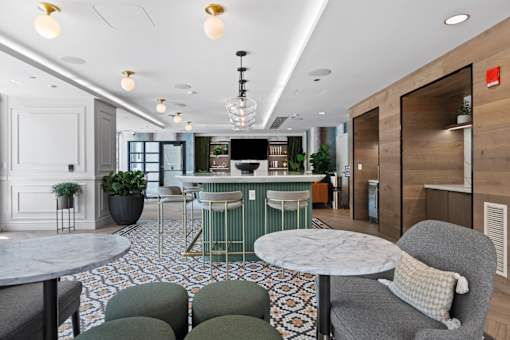 A modern dining area with a round table and chairs.