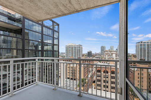A balcony with a view of the cityscape.