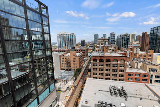 A cityscape with a mix of modern and older buildings.