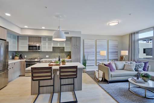a living room with a kitchen and a couch at L Seven, San Francisco, CA