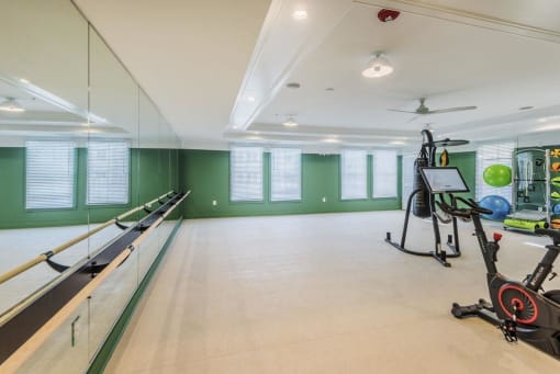 Spacious yoga and barre studio with spin bikes at The Merchant Apartments, South Carolina
