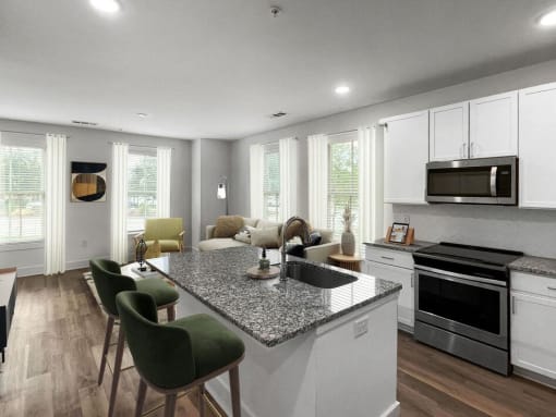 a kitchen and living room with a granite counter top at The Merchant Apartments, Charleston, South Carolina