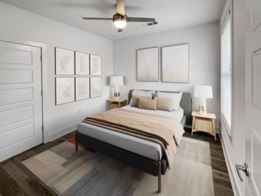 bedroom with a bed and a ceiling fan at The Merchant Apartments, Charleston